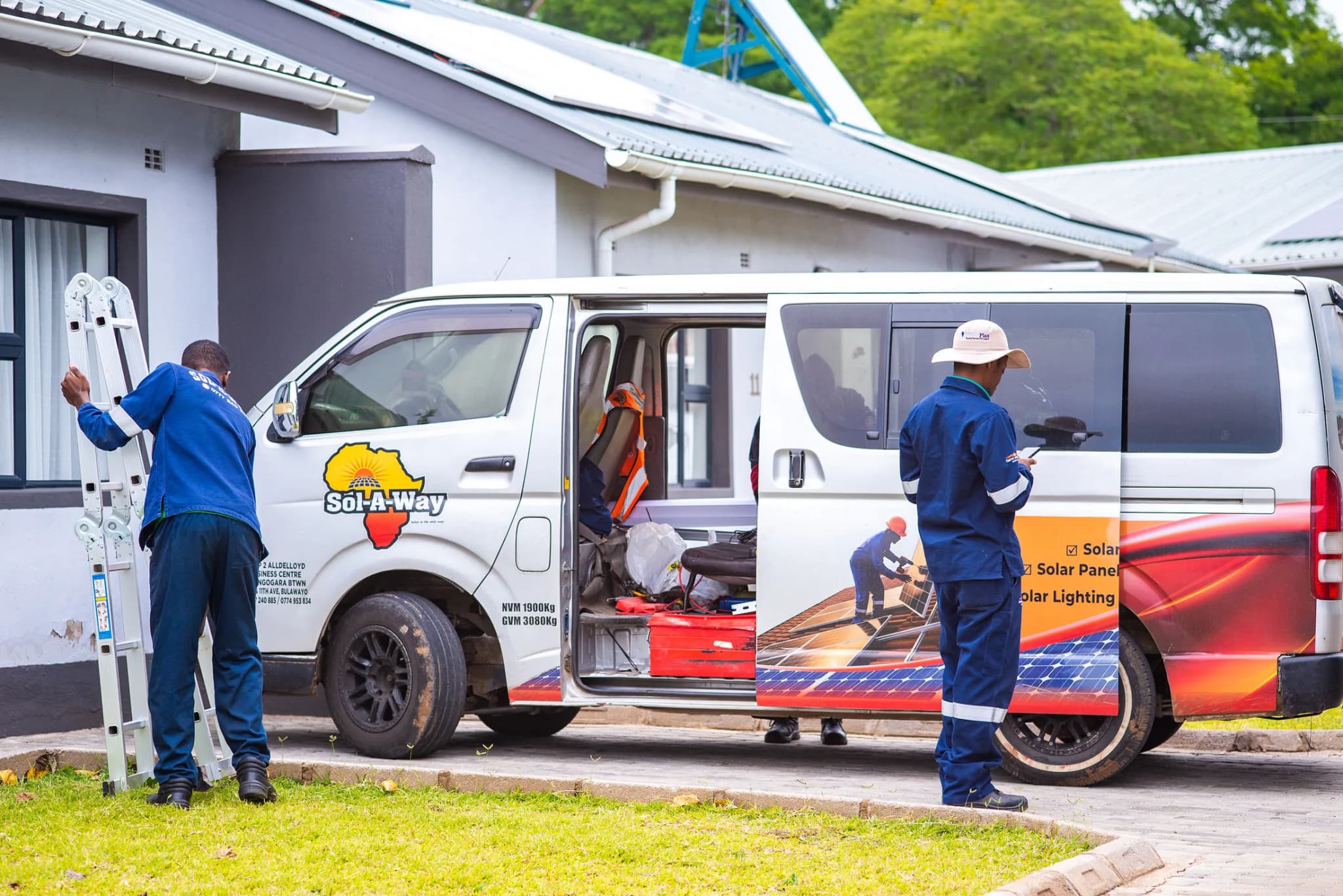 Sol-A-Way crew unloading equipment from the van