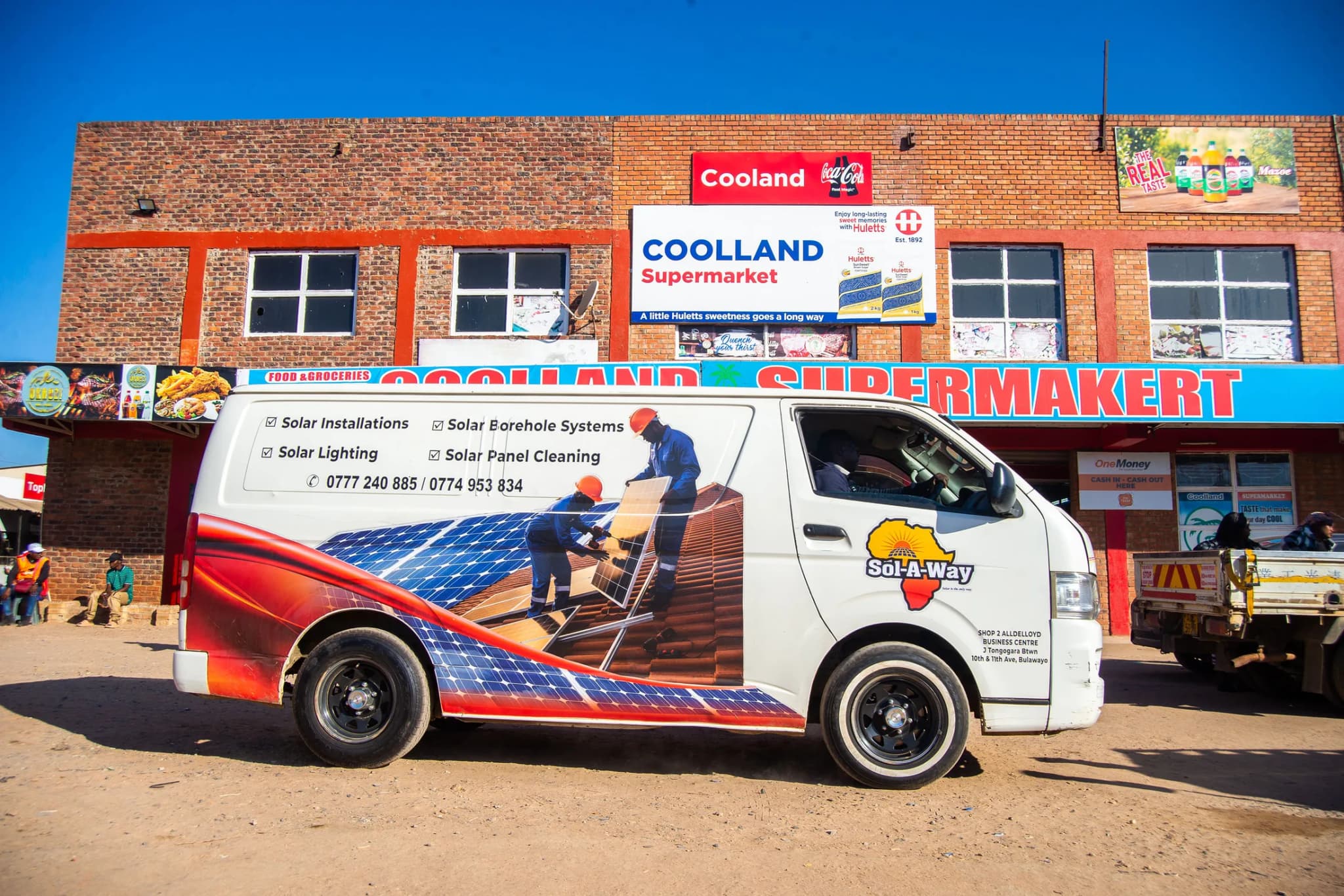 Branded Sol-A-Way van parked outside Coolland Supermarket in Maphisa