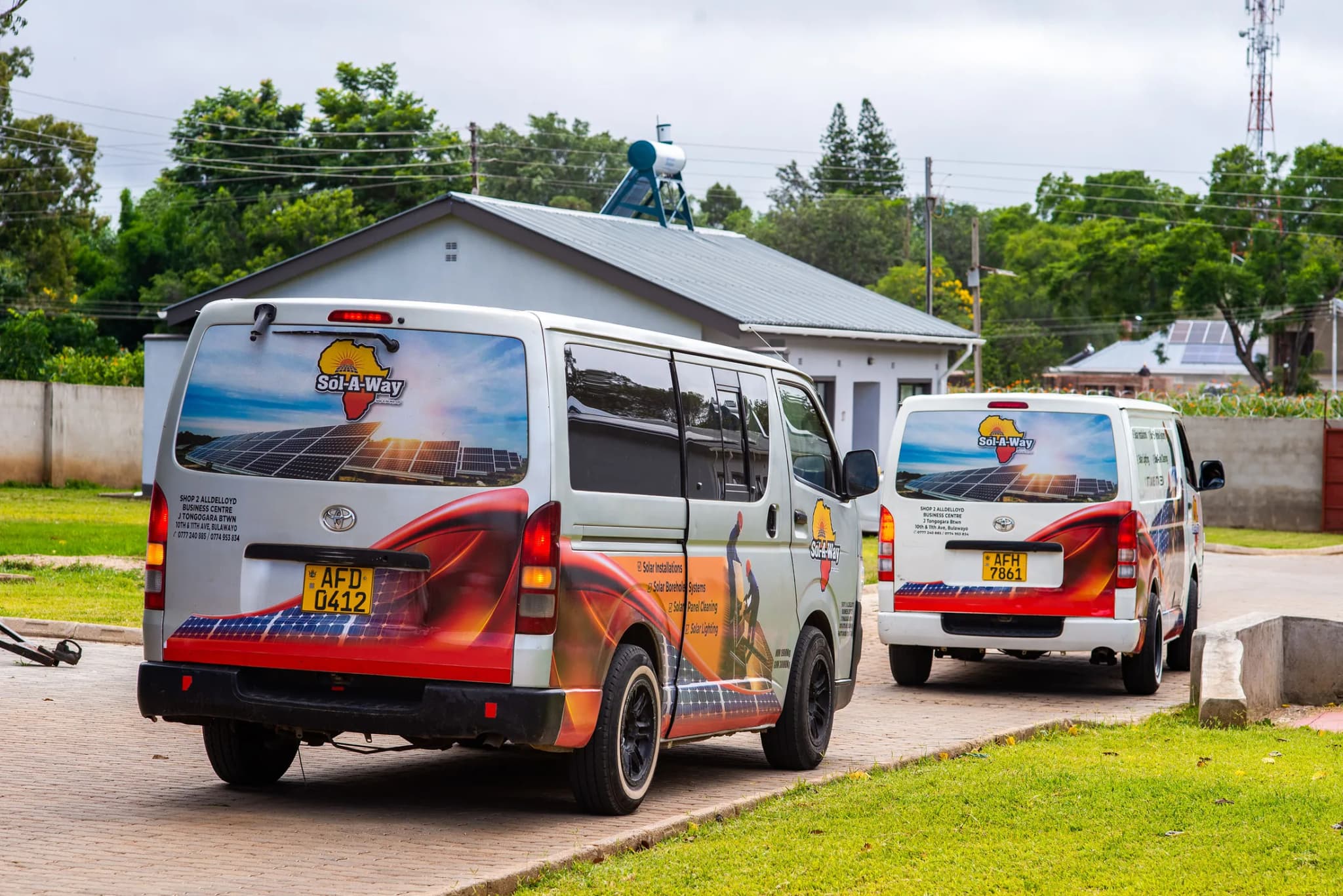 Two branded Sol-A-Way vans at the Amberwood estate