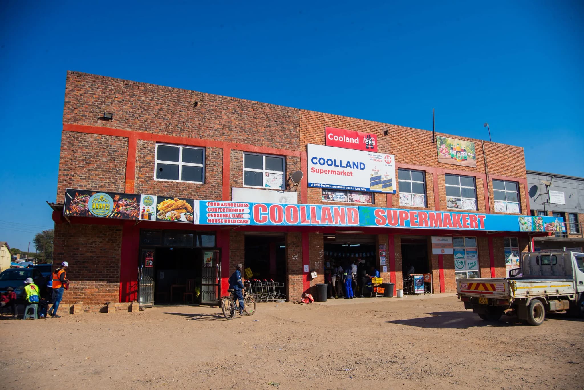 Coolland Supermarket building in Maphisa under a clear sky